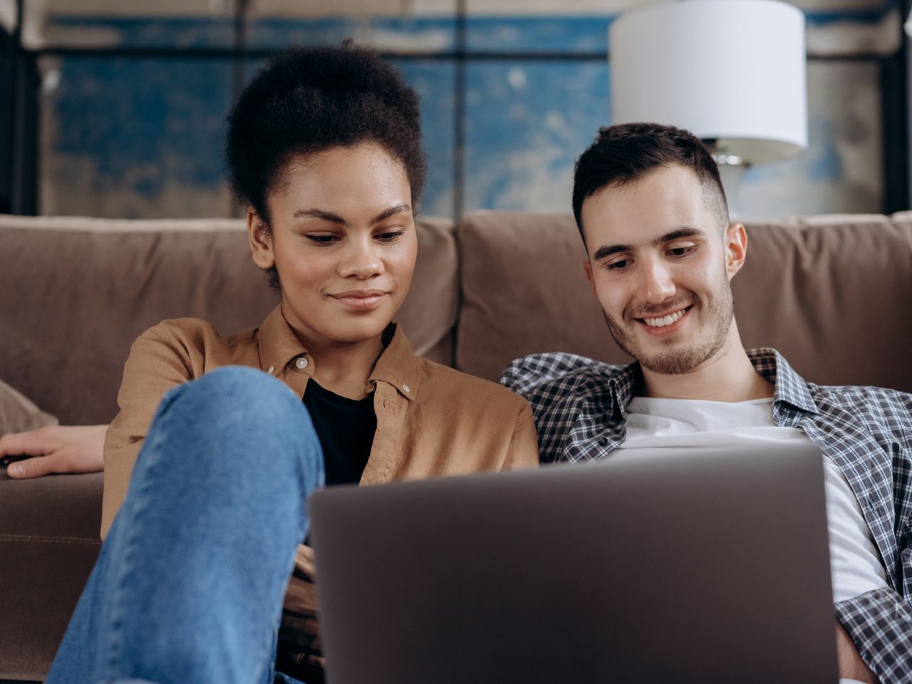 Couple reviewing coverage information on a laptop